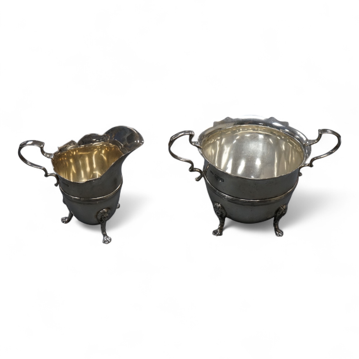 An Edwardian silver two handled sugar bowl and matching cream jug, by John Milward Banks, Chester, 1908, 13.6oz.